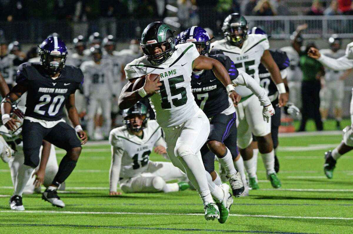 Mayde Creek's Julius Loughridge rushes as Morton Ranch's Samuel Hampton (7) and Matthew Apata (20) pursue during their District 19-6A football game Nov. 8 at Legacy Stadium. Apata blocked and returned a punt for a touchdown in a season-ending win against Clear Brook.
