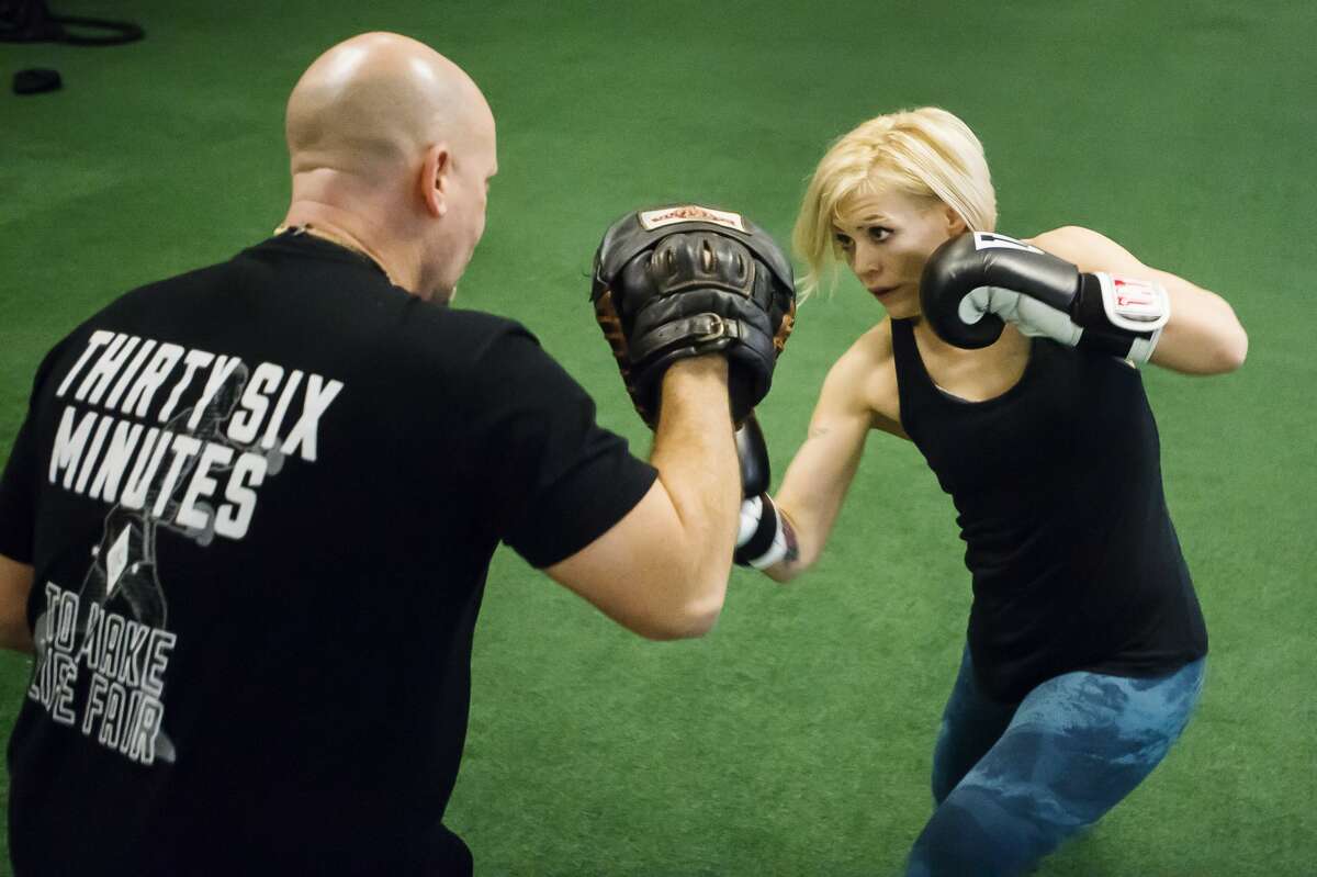 MMA fighter Kaelen Doan trains with her boxing coach, Erik Evers, at Edge Fitness and Training Headquarters Thursday, Nov. 7, 2019 in Midland. (Katy Kildee/kkildee@mdn.net)