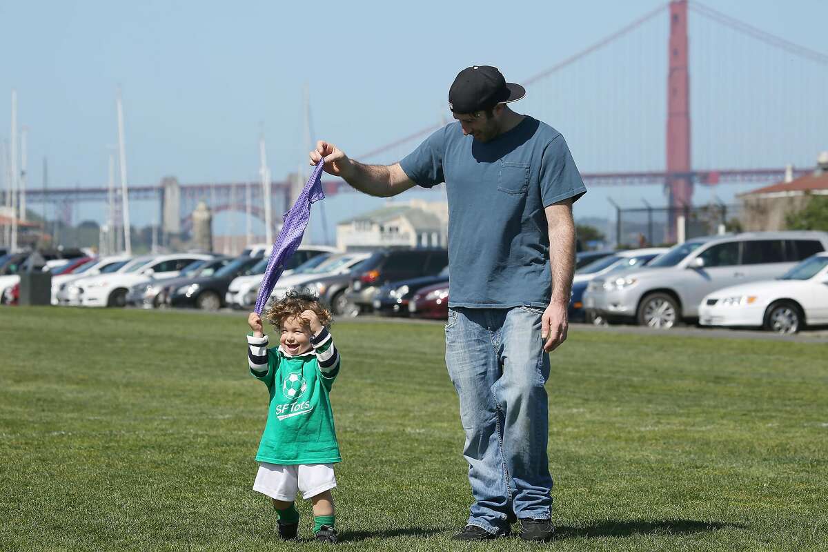 Paolo DeLosa-Tham, with his son while on California’s paid leave, at a water front park in San Francisco, on April 5, 2016. A new study conducted in California, which in 2004 became the first state to offer paid family leave, found new mothers who took it that year ended up working less and earning less a decade later and averaged $24,000 in cumulative lost wages. (Jim Wilson/The New York Times)