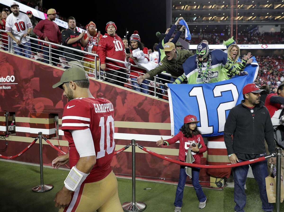 49ers quarterback Jimmy Garappolo (10) walks off the field after the 49ers were defeated 27-24 in overtime as the San Francisco 49ers played the Seattle Seahawks at Levi’s Stadium in Santa Clara, Calif., on Monday, November 11/11/19, 2019.