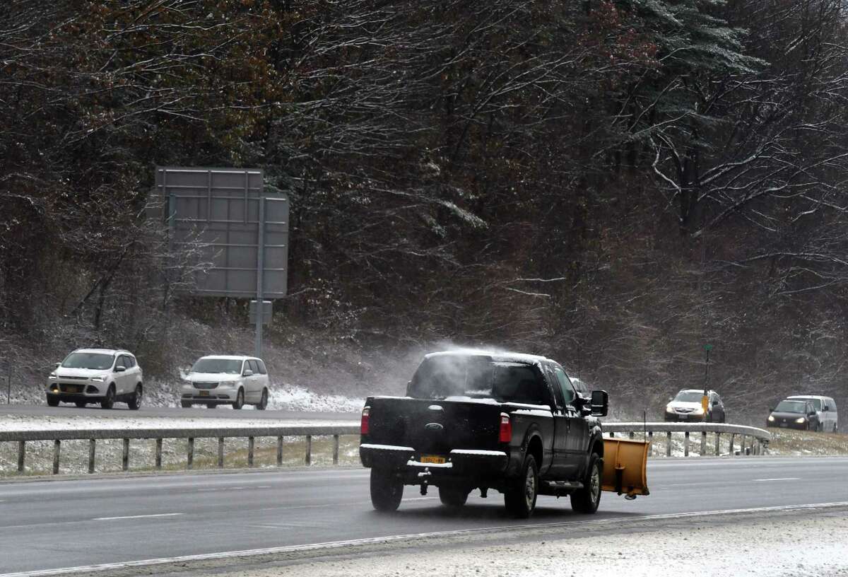 Snowplow operators head up the Northway northbound near Exit 9 on Tuesday, Nov. 12, 2019, in Clifton Park, N.Y. (Will Waldron/Times Union)