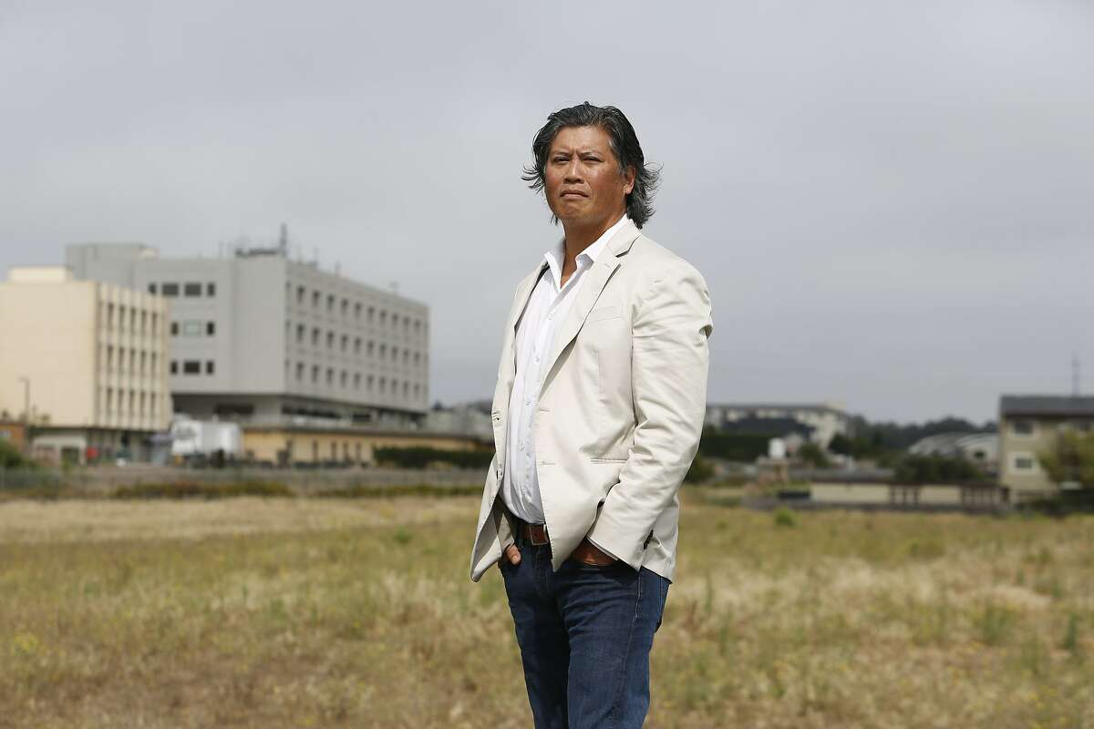 Eric Tao, managing partner L37 Partners, stands for a portrait on a development site in South San Francisco on Wednesday, August, 28, 2019 in South San Francisco, CA. Part of Kaiser Permanante's South San Francisco site can be side behind Tao.