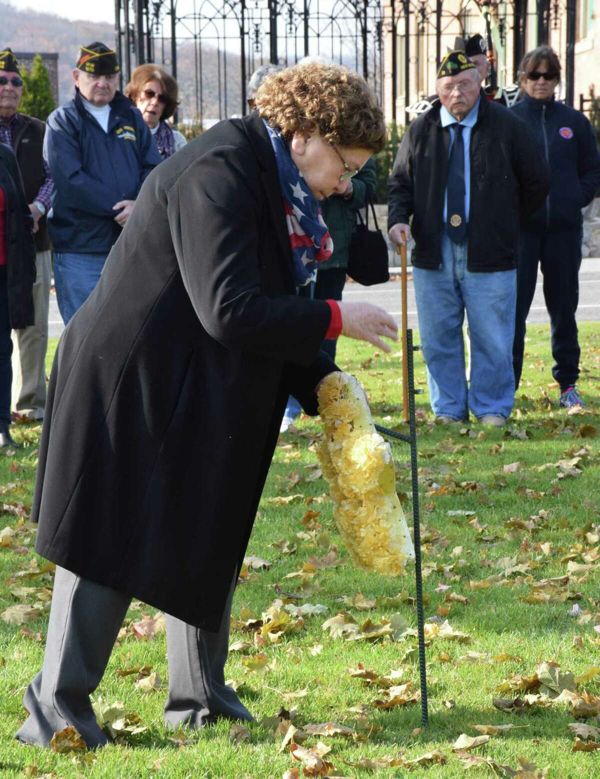 Mimi Leto, whose son Lance Cpl. Giuseppe "Joey" Leto died during a training exercise at Camp LeJeune in 1999, places the Gold Star wreath during the ceremony.