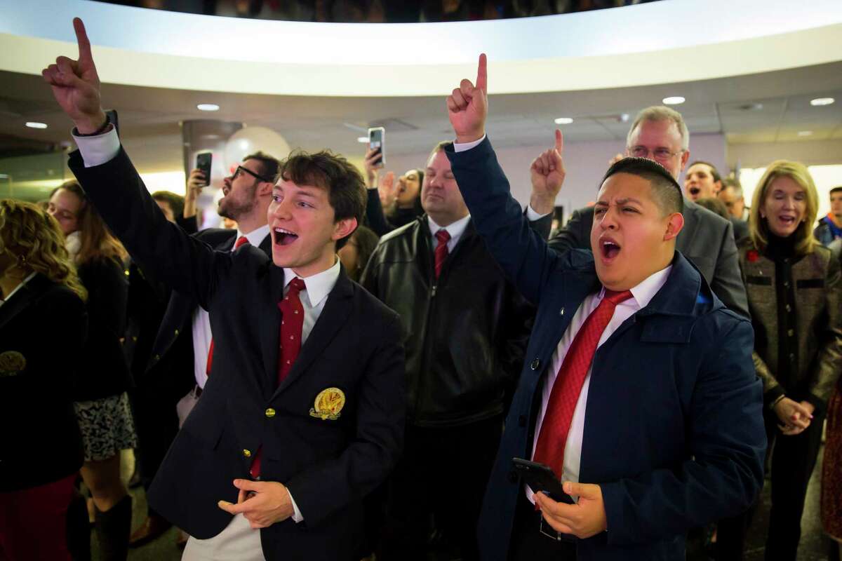 Class of 2020 students Alfred Cervantes and David Jaimes cheer during a celebration on Tuesday, November 12, 2019, at the University of Houston.