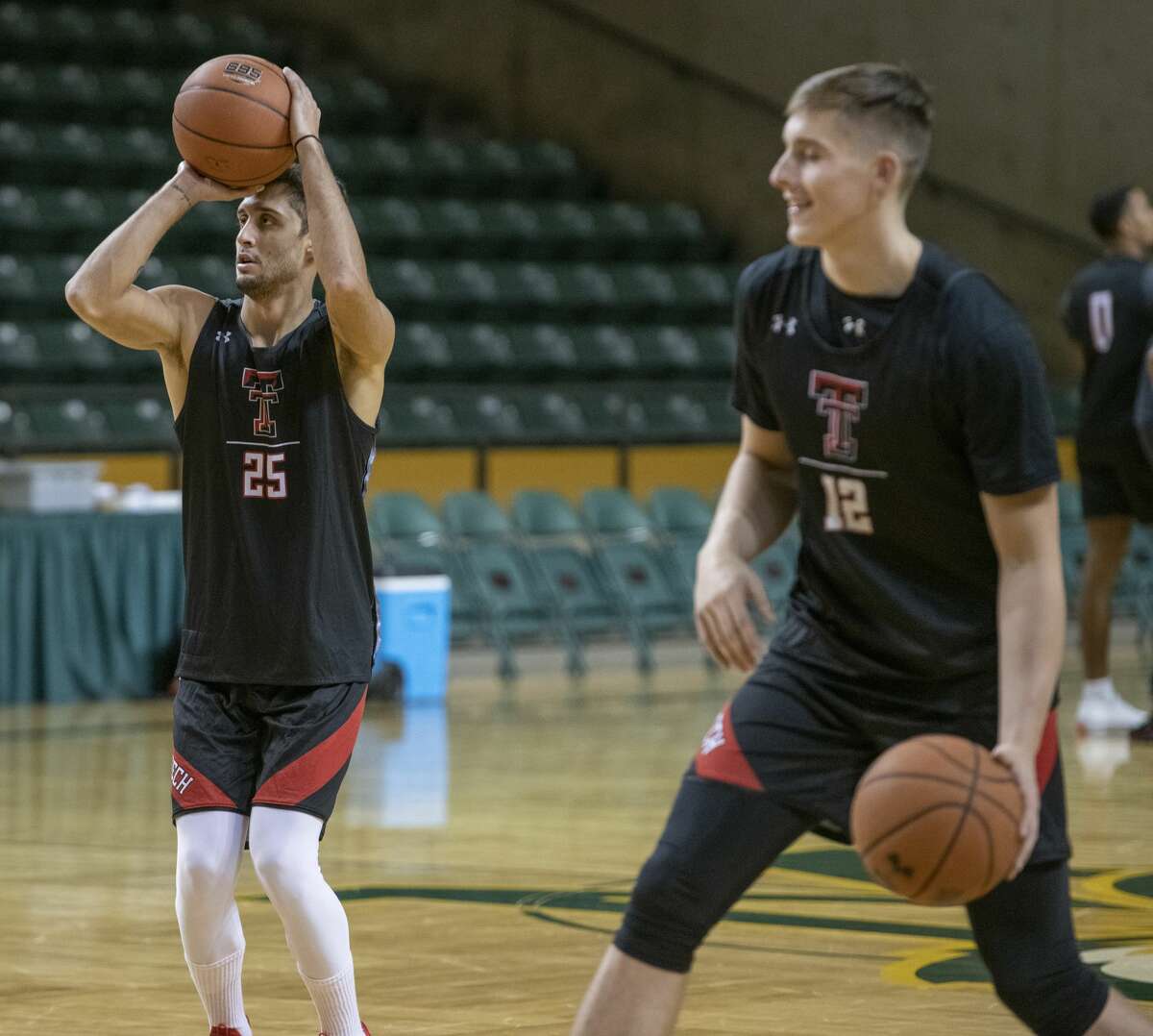 Texas Tech's Davide Moretti, 25, lines up a shot as he and other players practice 11/12/19 evening at the Chaparral Center as they prepare to take on Houston Baptist University today at Midland College. Tim Fischer/Reporter-Telegram