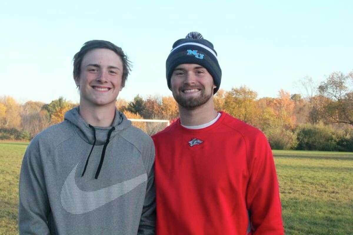 Brothers Jeffrey (left) and Chad Samuels take a break after a practice this season. (Herald Review photo/John Raffel)
