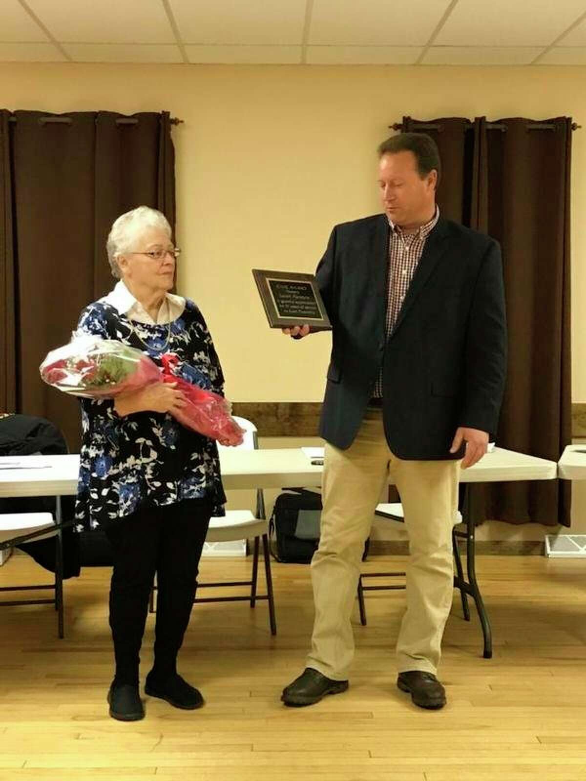 Evart Township Supervisor Doug Derscheid presented Trustee Sarah Parsons with a Civic Award in appreciation of her 51 years of service to the township at a meeting on Thursday, Nov. 7. (Submitted photo)