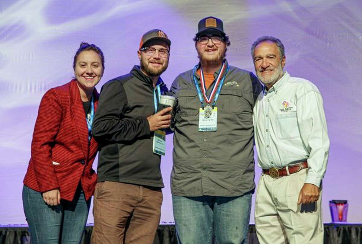 From left, Theresa Wasinski, Evan Westervelt, Kyle Sanborn and Charlie Papazian of the Great American Beer Festival pose for a photo together during the Great American Beer Festival in Denver. (Photo provided)