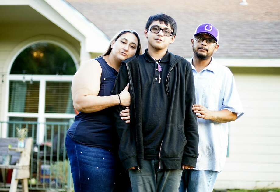 Xavier Castro outside his home with his parents in Dayton. After receiving free help from lawyers, Xavier now has special education services. Photo: Elizabeth Conley/Staff Photographer