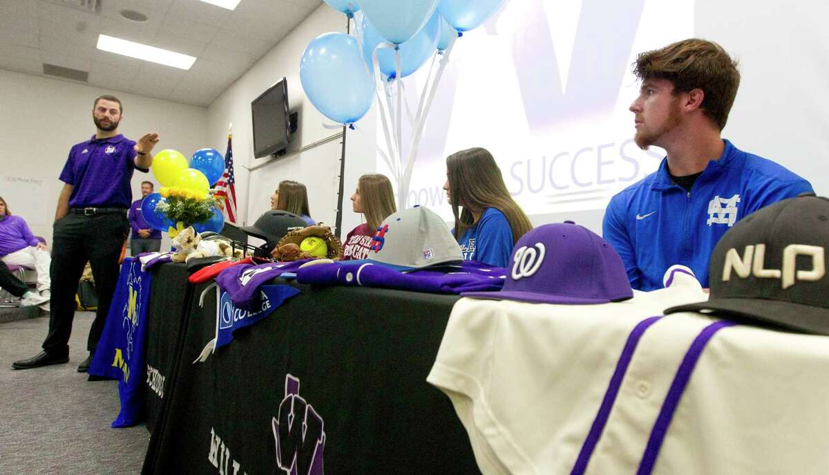 Willis baseball player Mason Creacy, right, signed to play baseball for Murray State during a National Signing Day ceremony at Willis High School, Wednesday, Nov. 13, 2019, in Willis. Creacy signed beside softball players Ashley Vallejo, Hannah Earls and Madison Matranga, who signed with McNeese State, Texas State and Odessa College, respectively.