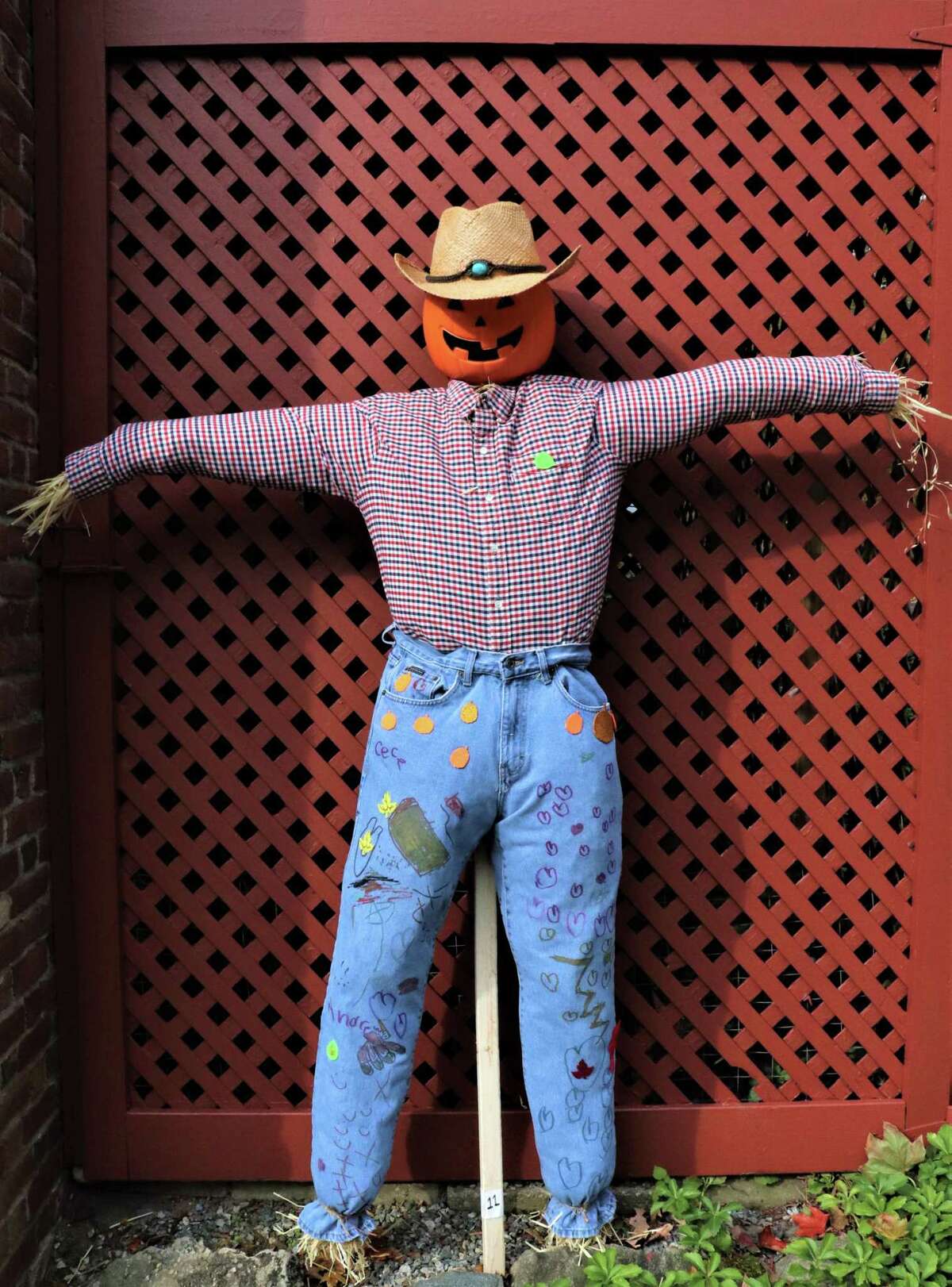 Jason Gong, CeCe Duques, and Andrew Duques, creators of Mr. Pumpkin Head, won the People's Choice Vote on Facebook in Keeler Tavern Museum & History Center's seventh annual Scarecrow Contest.