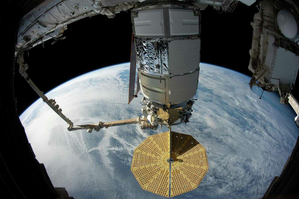 This NASA handout image released November 6, 2019 shows the US Cygnus space freighter from Northrop Grumman pictured in the grips of the Canadarm2 robotic arm as it was installed to the Unity module for 70 days of cargo transfers on November 4, 2019. (Photo by HO / NASA / AFP) / RESTRICTED TO EDITORIAL USE - MANDATORY CREDIT "AFP PHOTO /NASA/HANDOUT " - NO MARKETING - NO ADVERTISING CAMPAIGNS - DISTRIBUTED AS A SERVICE TO CLIENTS (Photo by HO/NASA/AFP via Getty Images)