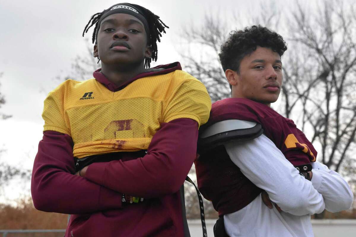 Sheehan’s Tre Childers and Jordan Davis stand at Riccitelli Field at Sheehan high, close to 20 months after a serious car crash injured both of them. (Pete Paguaga, Hearst Connecticut Media)