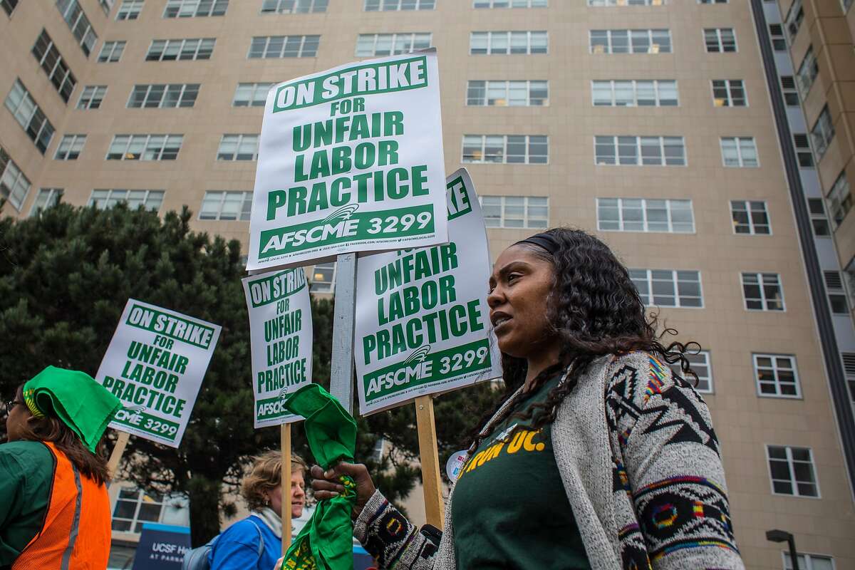 University of California workers hold a one day strike to protest what the workers' union, AFSCME 3299, says are illegal actions by UC to hire cheaper contractors to do their work on Wednesday, November 13, 2019 at UCSF in San Francisco, Calif.