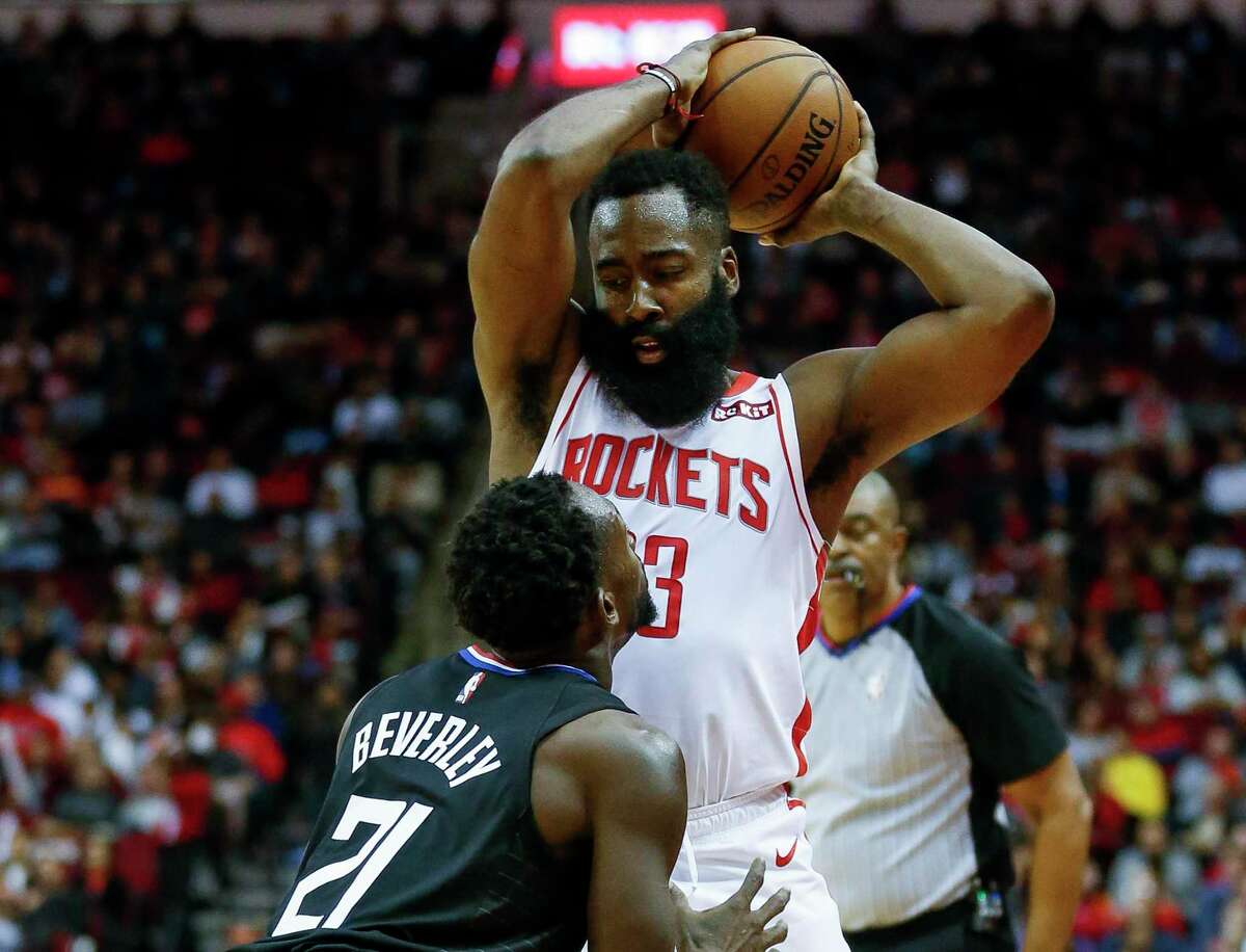 Rockets guard James Harden plots his options while defended by the Clippers’ Patrick Beverley at Toyota Center on Wednesday night.