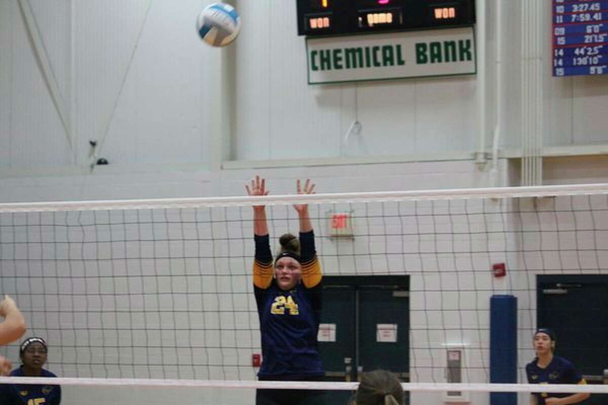 Baldwin's Abby Oisten goes up for the ball in last week's district semifinal match at Baldwin. (Star photo/John Raffel)