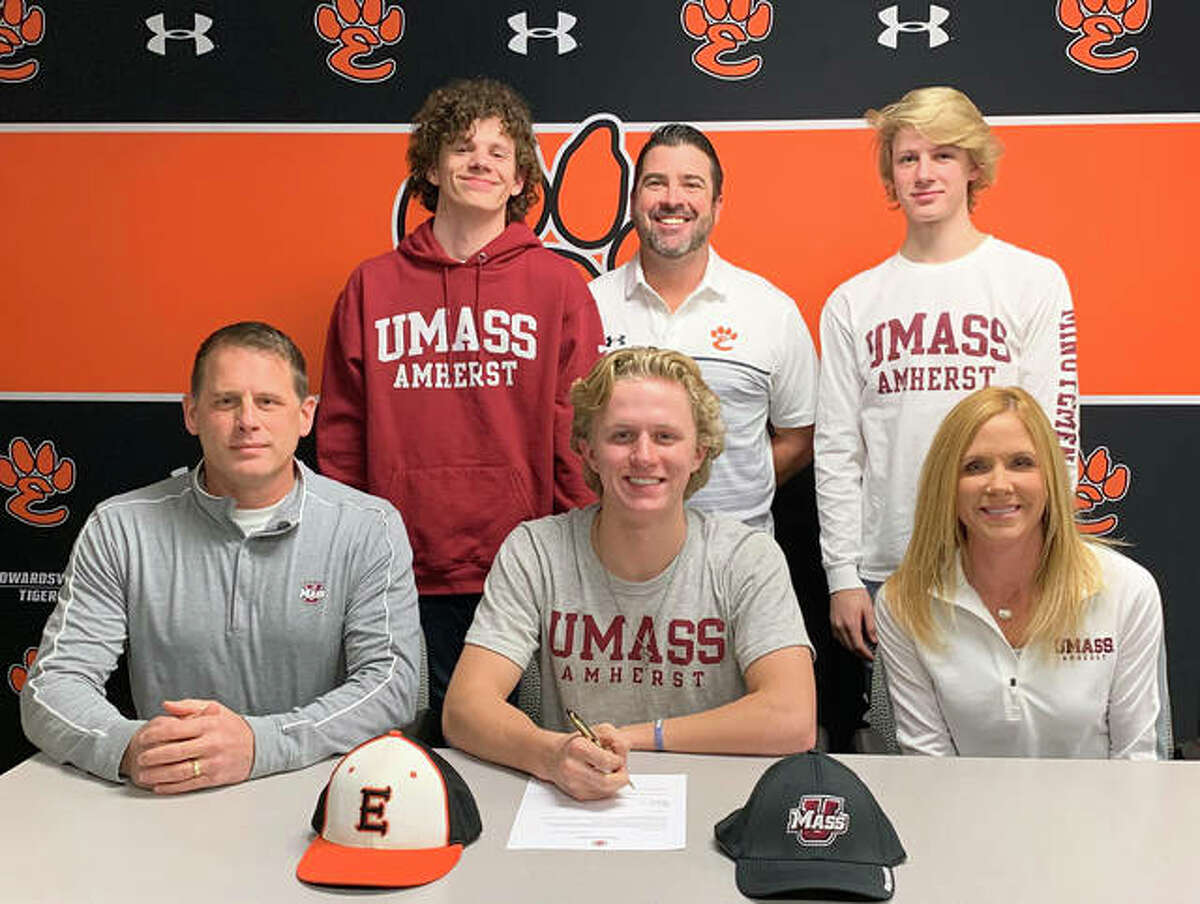 Edwardsville senior Will Range, seated center, signed a letter of intent to play baseball for the University of Massachusetts. He is joined by his parents, brothers and EHS coach Tim Funkhouser.