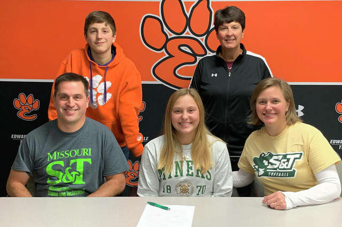 Edwardsville senior Ellie Viox, seated center, will play softball for Missouri S&T. She is joined by her parents, brother and EHS coach Lori Blade.