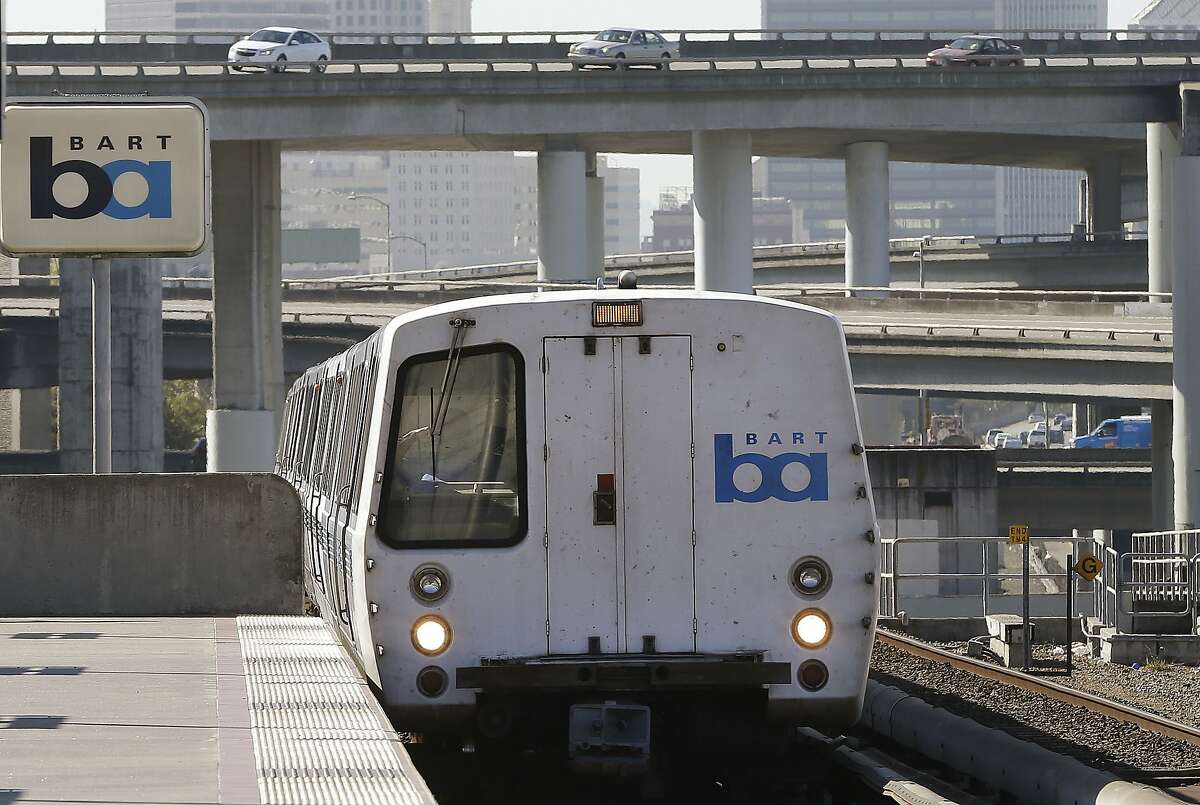 FILE - A BART train departs the MacArthur station in Oakland, Calif. 