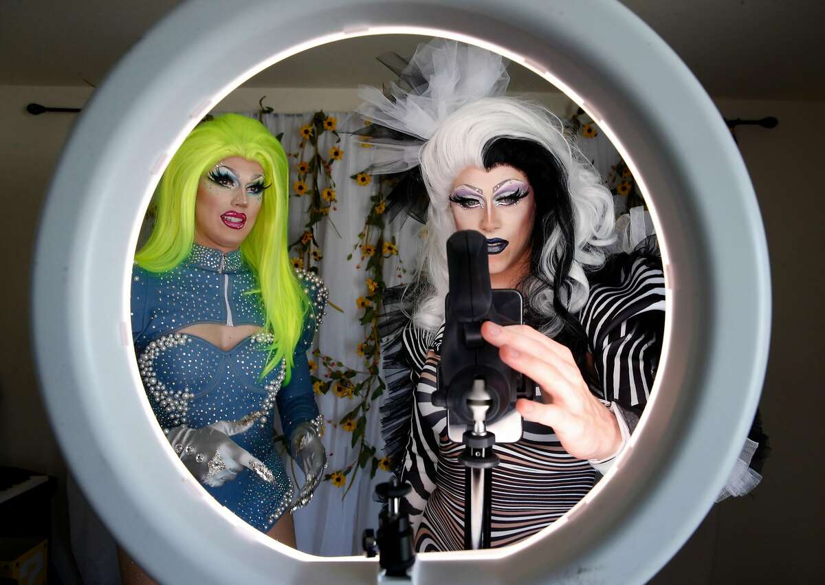 Scott Artice (left) and his husband Zachary record a session for their popular "Minnie and Tink" drag queen webcast created on the TikTok social media app in Daly City, Calif. on Saturday, Nov. 2, 2019.