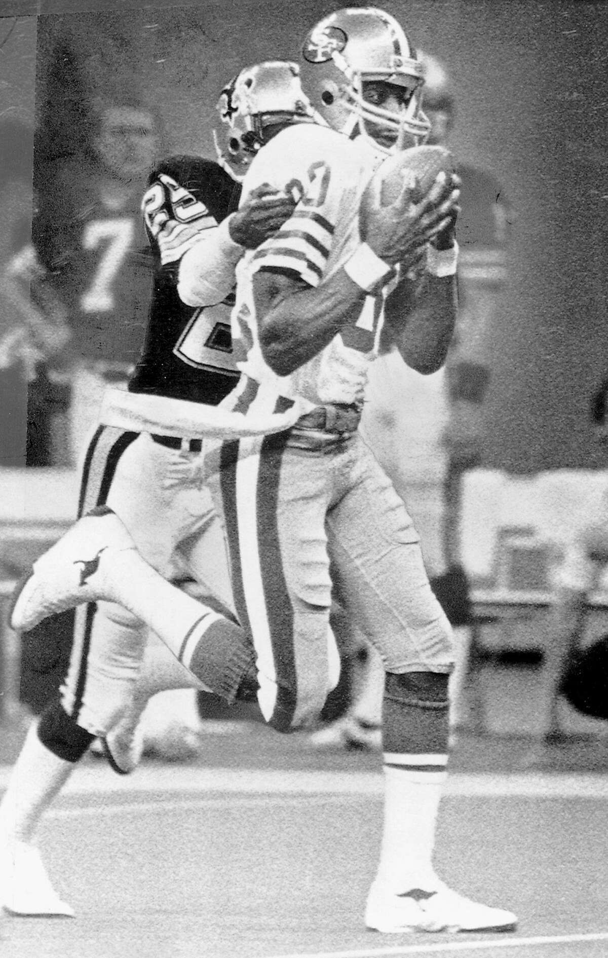 49ers17_ph5.jpg December 15, 1985 - Jerry Rice (80) grabs a long pass from Joe Montana over New Orleans Saints cornerback Johnnie Poe during fourth quarter action in New Orleans. Frederic Larson/ San Francisco Chronicle File Photo/1985 Ran on: 11-17-2006 Jerry Rice's hands and great concentration bring in his second of 4 TDs against the St. Louis Rams in 1986. Ran on: 11-17-2006 Jerry Rice's hands and great concentration bring in his second of 4 TDs against the St. Louis Rams in 1986. Ran on: 04-25-2010 Wide receiver Jerry Rice was a first-round draft pick, taken 16th overall by the 49ers in 1985.