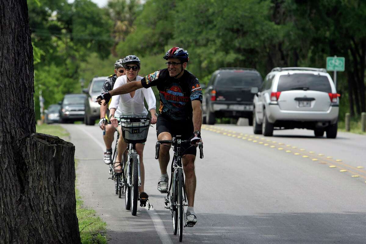 Richard Barn points out a feature at a constricted portion of Mulberry Avenue near Broadway as he tours on a bicycle ride with Julia Diana of the Office of Environmental Policy in April 2010. San Antonio Mayor Ron Nirenberg and others have supported adding bike lanes on Broadway from Interstate 35 to Houston Street.