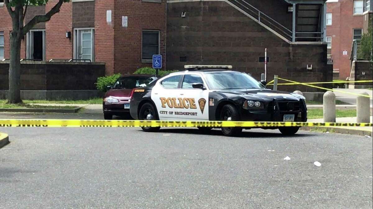 A police car outside a crime scene at the Greene Homes housing project.
