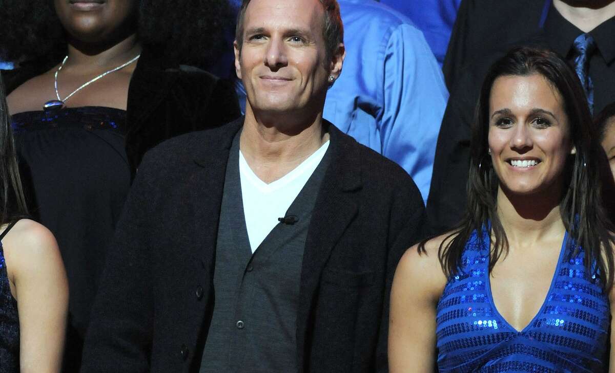 BROOKLYN, NY - DECEMBER 16: Singer Michael Bolton and Host Maria Menounos along with members from his New Haven based choir during the Clash of the Choirs rehearsal show at the Steiner Studios in Brooklyn on December 16, 2007 in New York. (Photo by George Napolitano/FilmMagic)