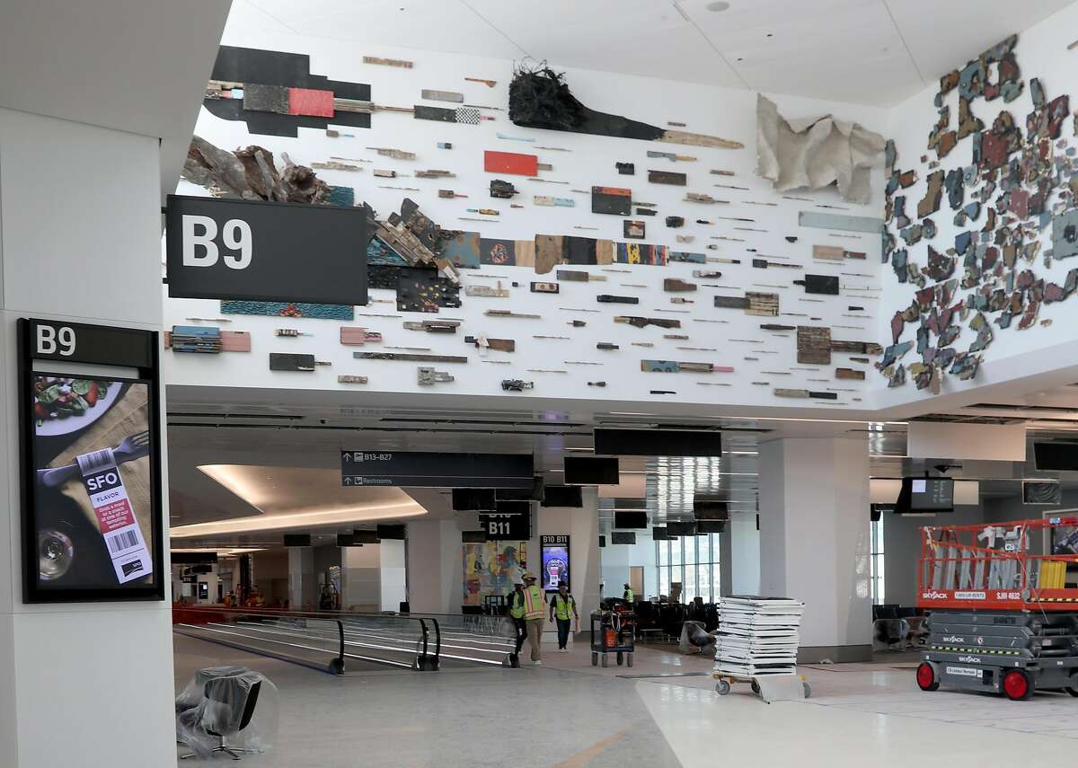 A multi layered installation by Leonardo Drew can be seen above at the new Harvey Milk Terminal 1 at SFO on Tuesday, June 25, 2019 in South San Francisco, Calif. The artwork reflects the cross-section of people passing through SFO who carry with the a multitude of life experiences and cultures.