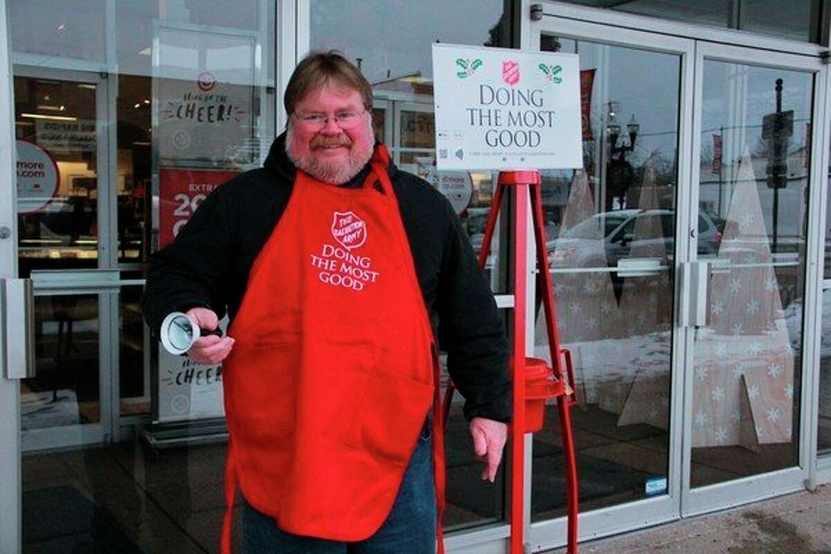 Salvation Army bell ringer Brian Carr spent his Thursday morning giving back as he stood in front of JCPenny in Big Rapids, asking locals for donations. According to Salvation Army Envoy Ed Hoskins, donations made during the red kettle campaign can provide Salvation Army with various opportunities to give back to the community, as well as those in need. (Herald Review photo/Alicia Jaimes)