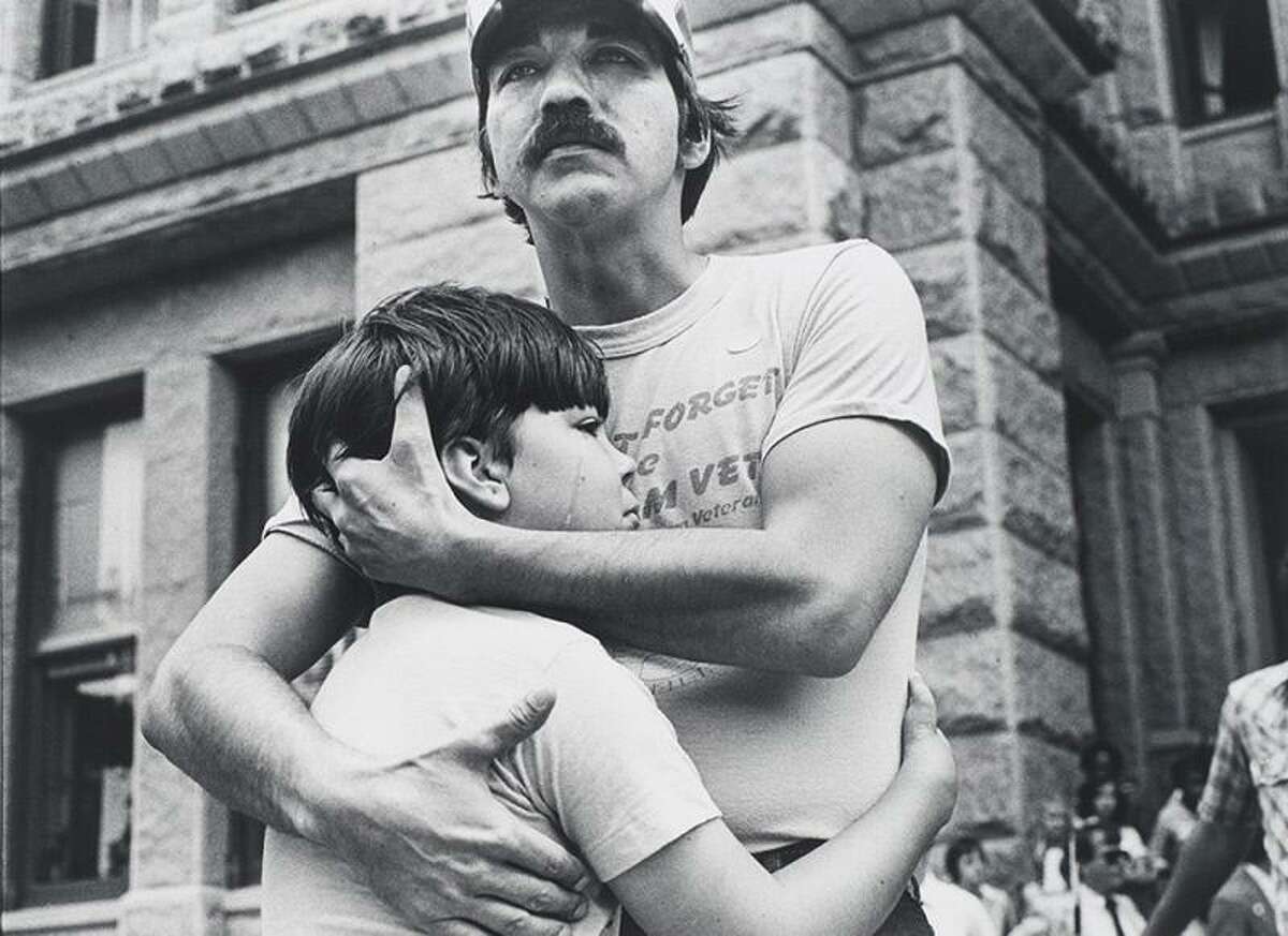 “Vietnam veteran Dan Jordan with his son Chad outside the Texas State Capitol in Austin after a public speech he made at a rally to raise awareness about the health effects of exposure to the herbicide Agent Orange,” 1981