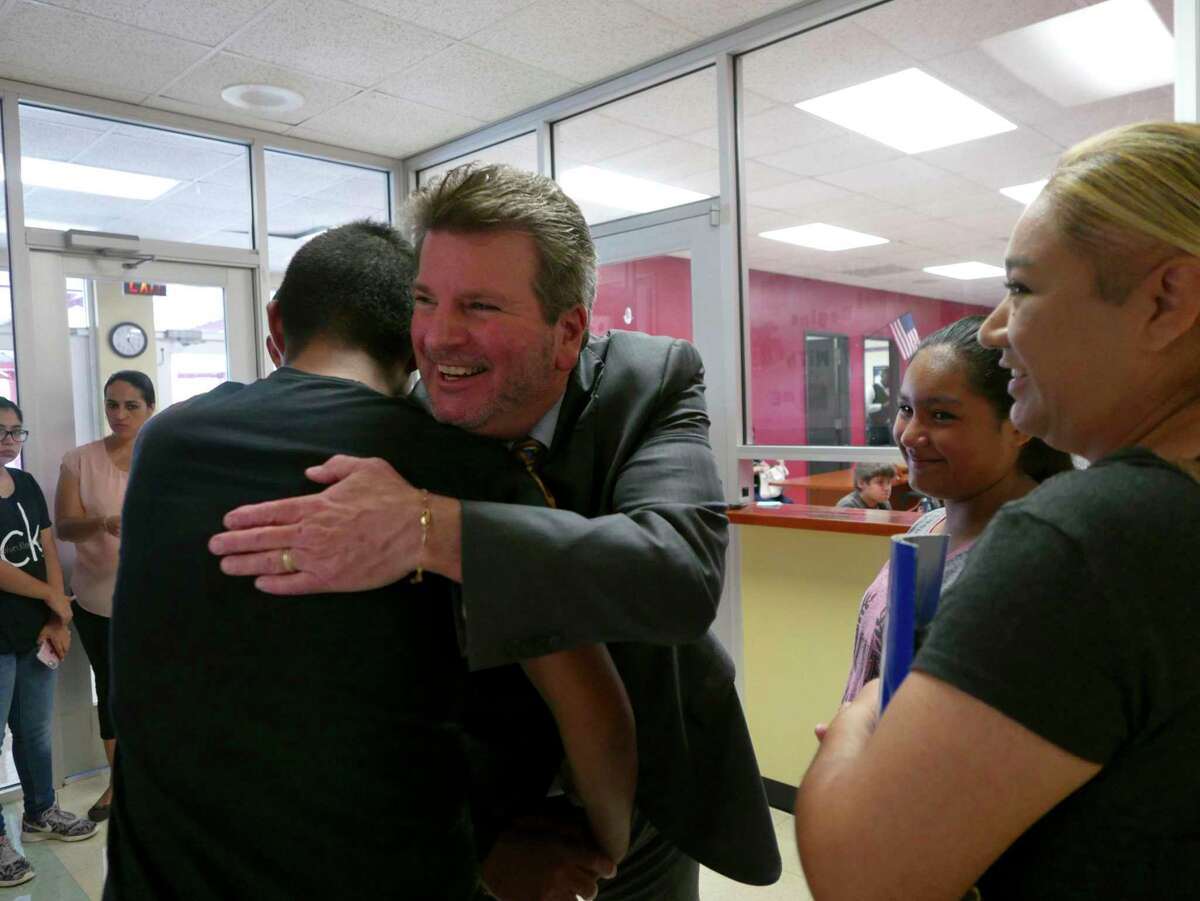 Southside ISD Superintendent Mark Eads embraces student Mark Gomez on the first day of registration at the start of the 2017-18 school year. Mark was headed to mddle school.