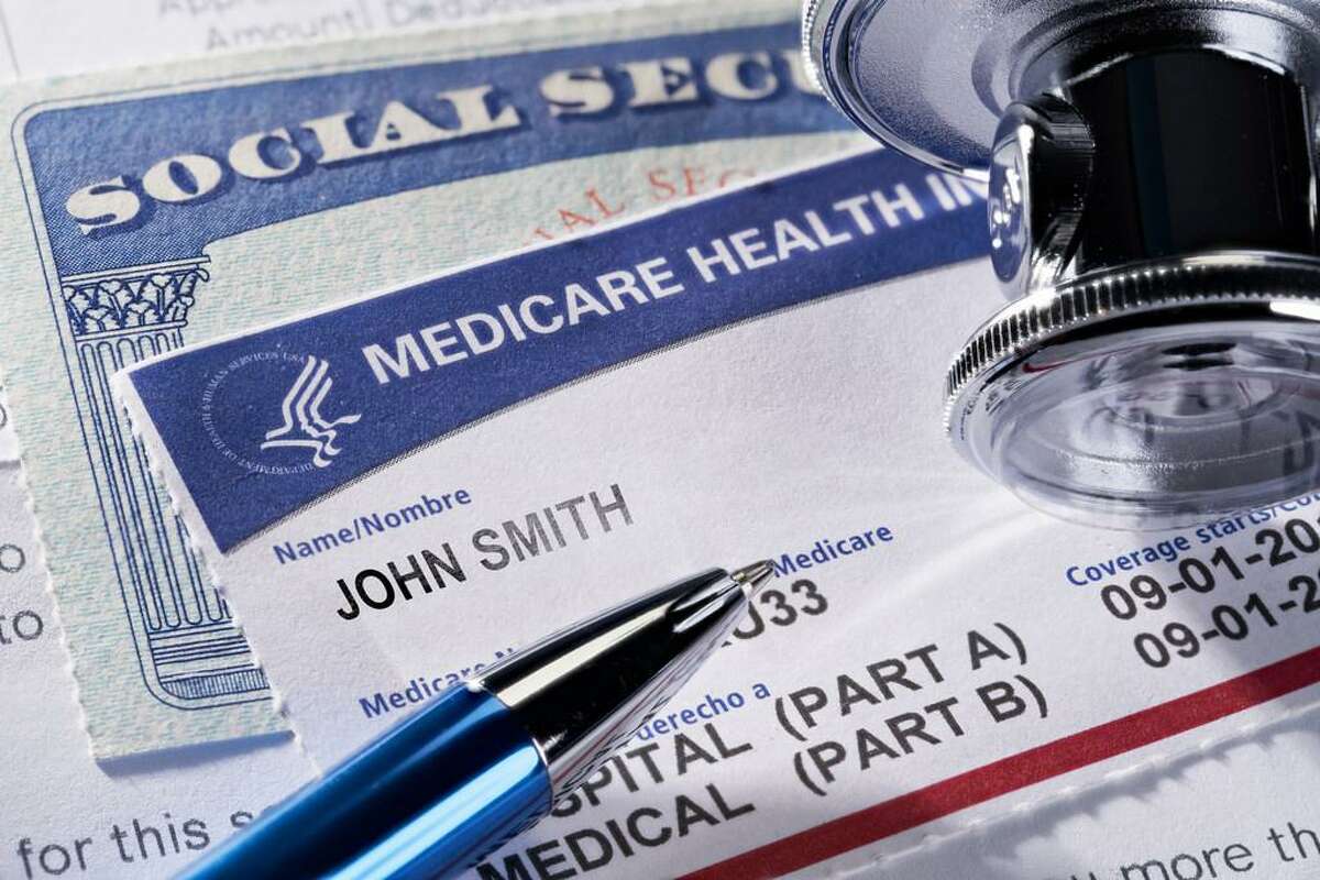Medicare Health Insurance and Social Security card on medical report with stethoscope. Medicare is a national health insurance program provided by the United States for seniors 65 and older. Social Security is a federal insurance program that gives benefits to retired, unemployed and disabled people.