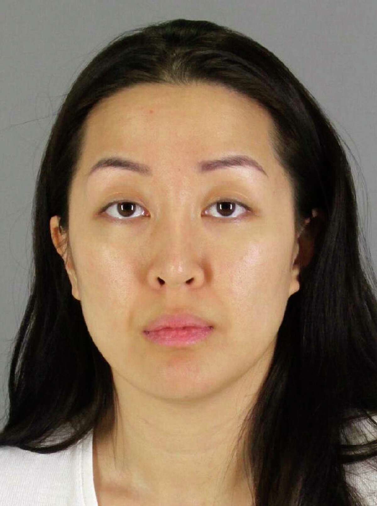 FILE - This undated booking photo provided by the San Mateo County, Calif., Sheriff's Office shows Tiffany Li. After deliberating for 12 days, jurors said Friday, Nov. 15, 2019 that Li is not guilty of conspiring with her boyfriend to kill 27-year-old Keith Green in 2016. (San Mateo County Sheriff's Office via AP, File)