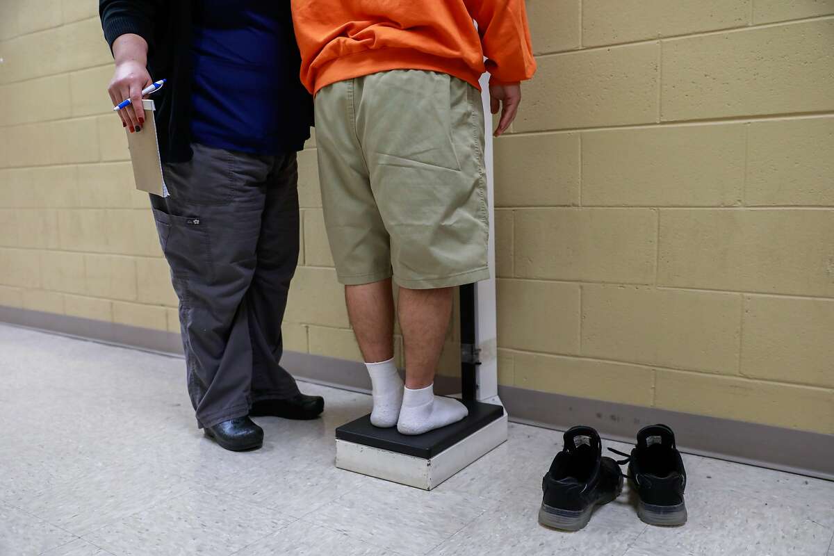 A youth is weighed at the Fresno County Juvenile Hall in Fresno, California, on Tuesday, Sept. 17, 2019.