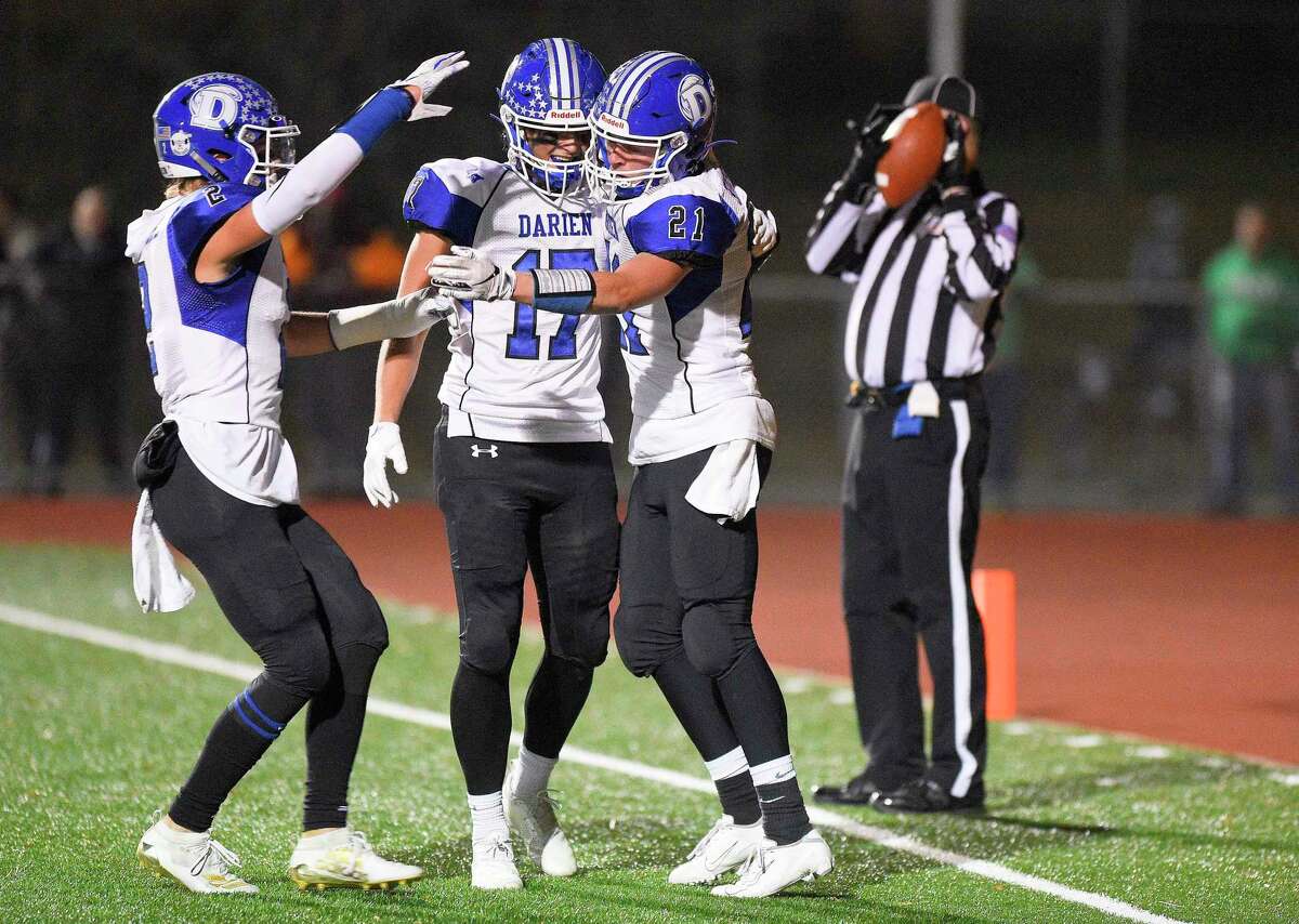 Darien's Will Kirby (21) at right, celebrates his first half touchdown against Norwalk in a FCIAC football game at Norwalk High School Testa Field on Nov. 15, 2019 in Norwalk Connecticut.