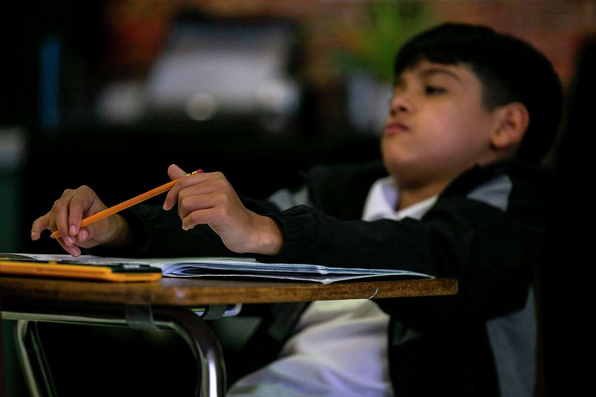 Emanuel Contreras listens to his teacher during his eighth grade science class at Cotton Academy last week. Cotton has been named a high-performing high-poverty school by the Houston-based nonprofit Children at Risk for its middle school performance.