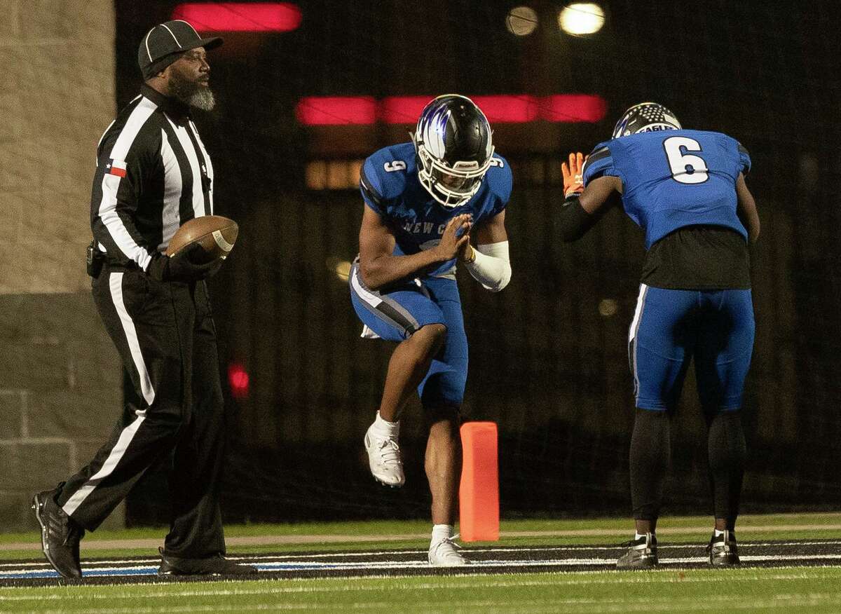 New Caney wide receiver Phillip McDaniel, Jr. (6) bows to quarterback Zion Childress (9) after his 95-yard touchdown run during the third quarter of a Region III-5A bi-district high school football playoff game at Randall Reed Stadium, Friday, Nov. 15, 2019, in New Caney.