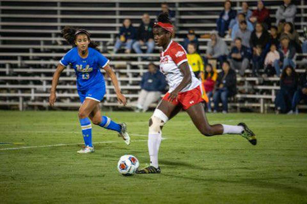 Lamar forward and Southland Conference Newcomer of the Year Esther Okoronkwo dribbles the ball upfield against UCLA in the opening round of the NCAA Championships.