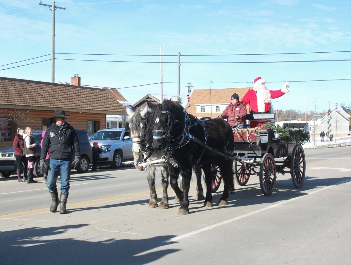 Friends and families of all ages lined Michigan Avenue in Baldwin to ring in the holiday season with the annual Santa Parade on Saturday.