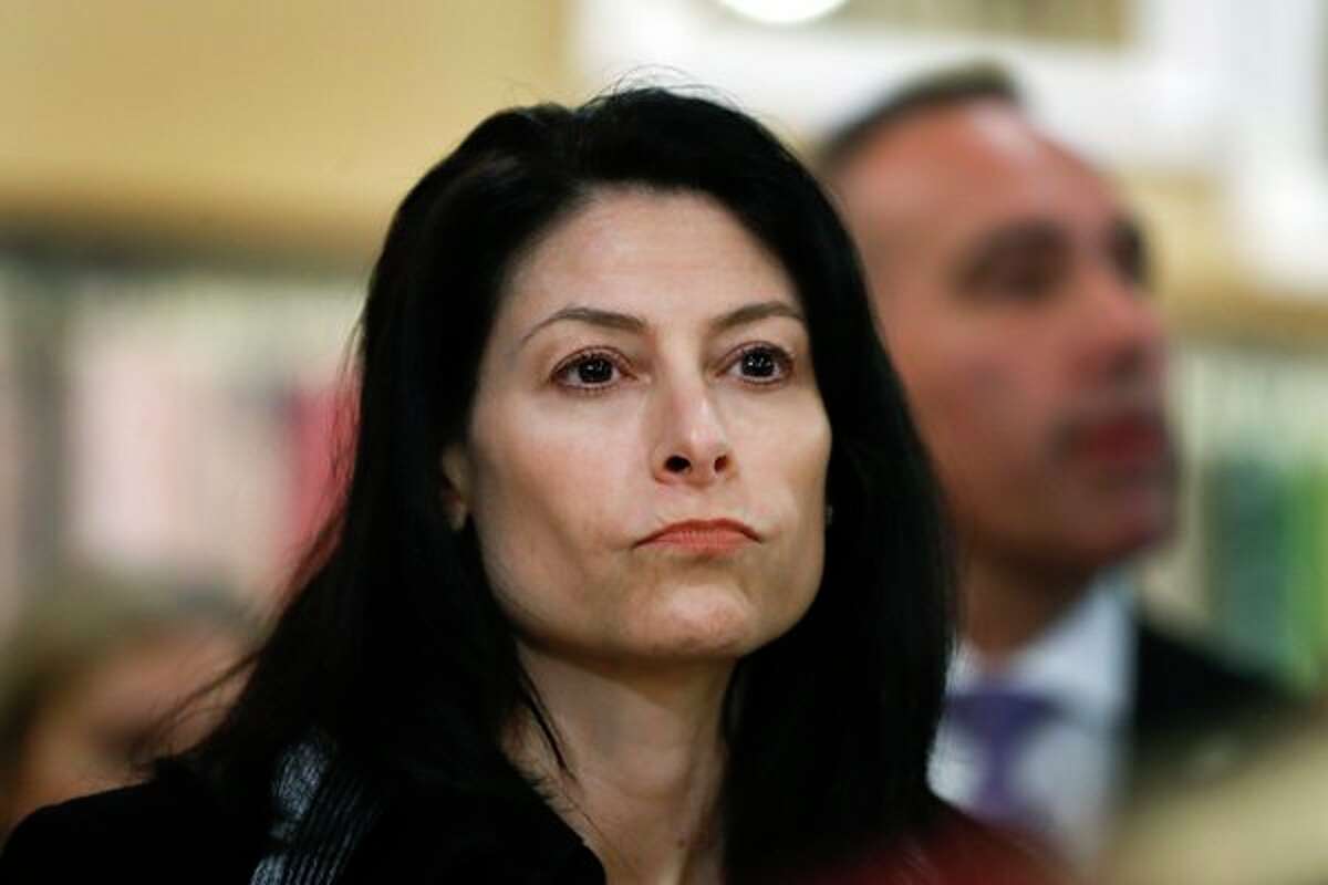 FILE - In this March 18, 2019, file photo, Michigan Attorney General Dana Nessel is seen in Clawson, Mich. Nessel plans a crackdown on illegal robocalls. On Friday, Nov. 15, 2019, she announced a dozen initiatives aimed at putting a halt to the calls, many of which she says are scams. (AP Photo/Paul Sancya File)