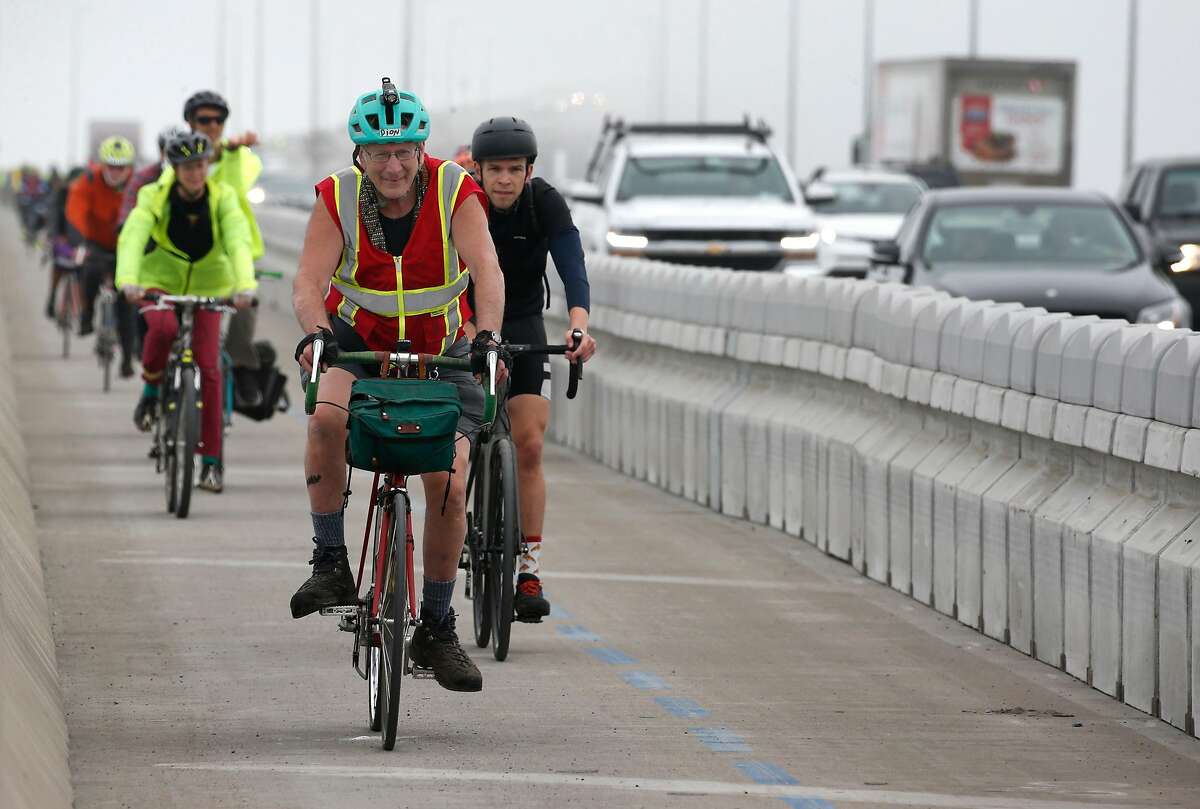 Bicyclists complete their inaugural ride across the Richmond-San Rafael Bridge after the new bike and pedestrian path on the span is opened to the public in San Rafael, Calif. on Saturday, Nov. 16, 2019.