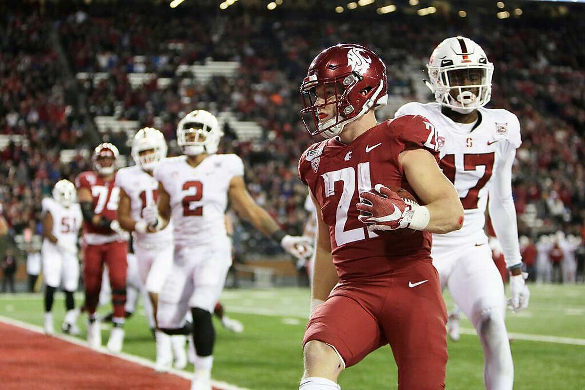 Washington State’s Max Borghi scores a TD in a 49-22 win over Stanford last season. The teams’ 2020 meeting, set for Saturday, was canceled as WSU deals with the coronavirus.