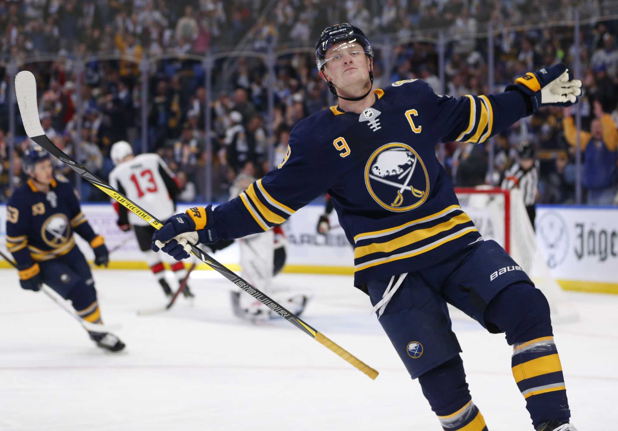 Buffalo Sabres Linus Ullmark (35) and Jack Eichel (9) celebrate a