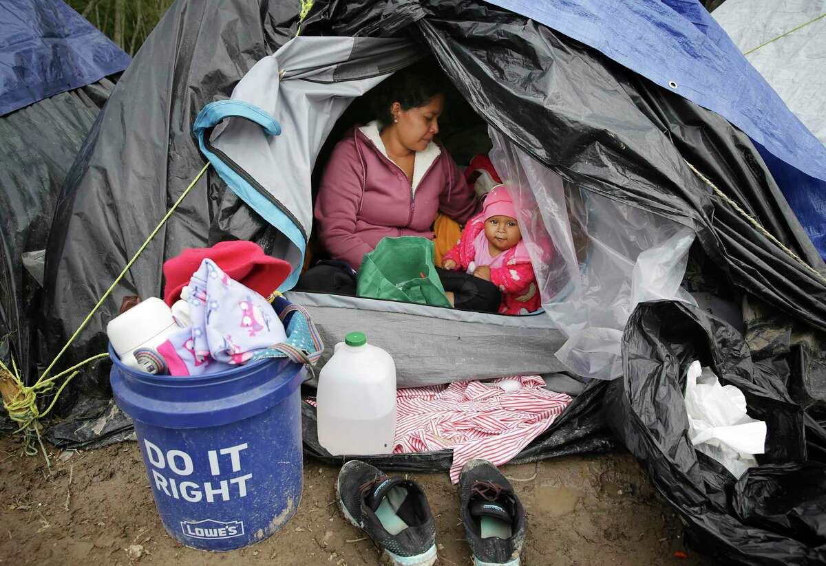 Justina Vasquez Lopez, 26, from Nicaragua, was with her young daughter at the asylum camp in Matamoros last November. A medical nonprofit announced Tuesday that the camp, now with 2,000 people, has its first COVID-19 infection.
