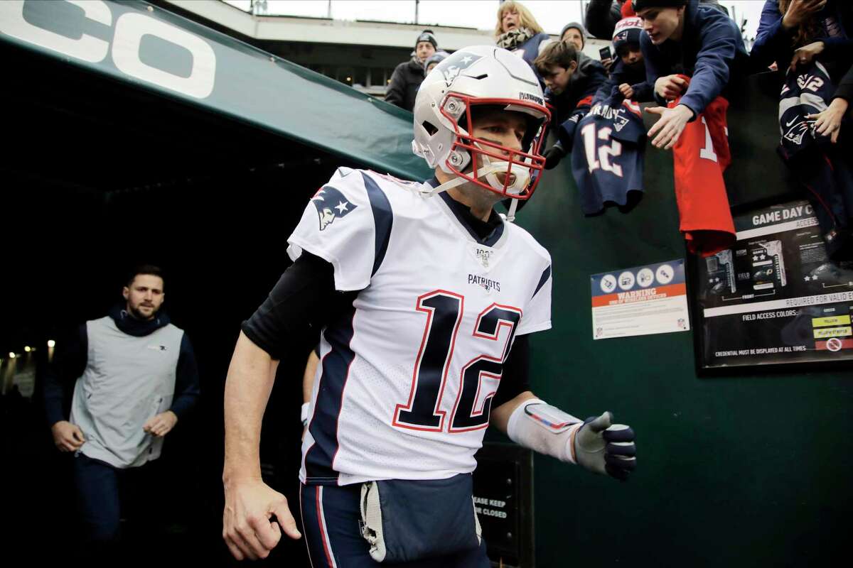 New England Patriots' Tom Brady runs onto the field before an NFL football game against the Philadelphia Eagles, Sunday, Nov. 17, 2019, in Philadelphia. (AP Photo/Matt Rourke)