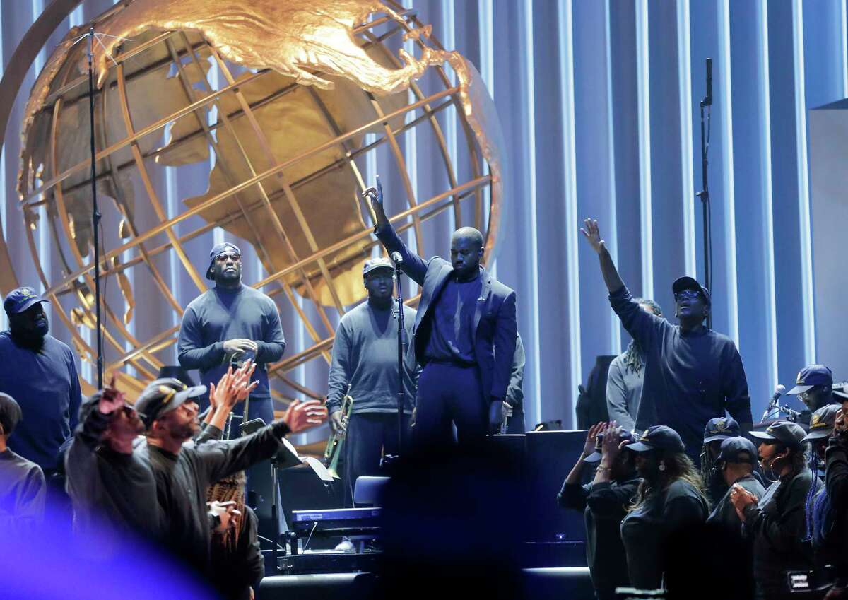 Rapper Kayne West performs with a choir some of the songs from his "Jesus is King" album during a Sunday Service Experience at Lakewood Church on Sunday, Nov. 17, 2019 in Houston.