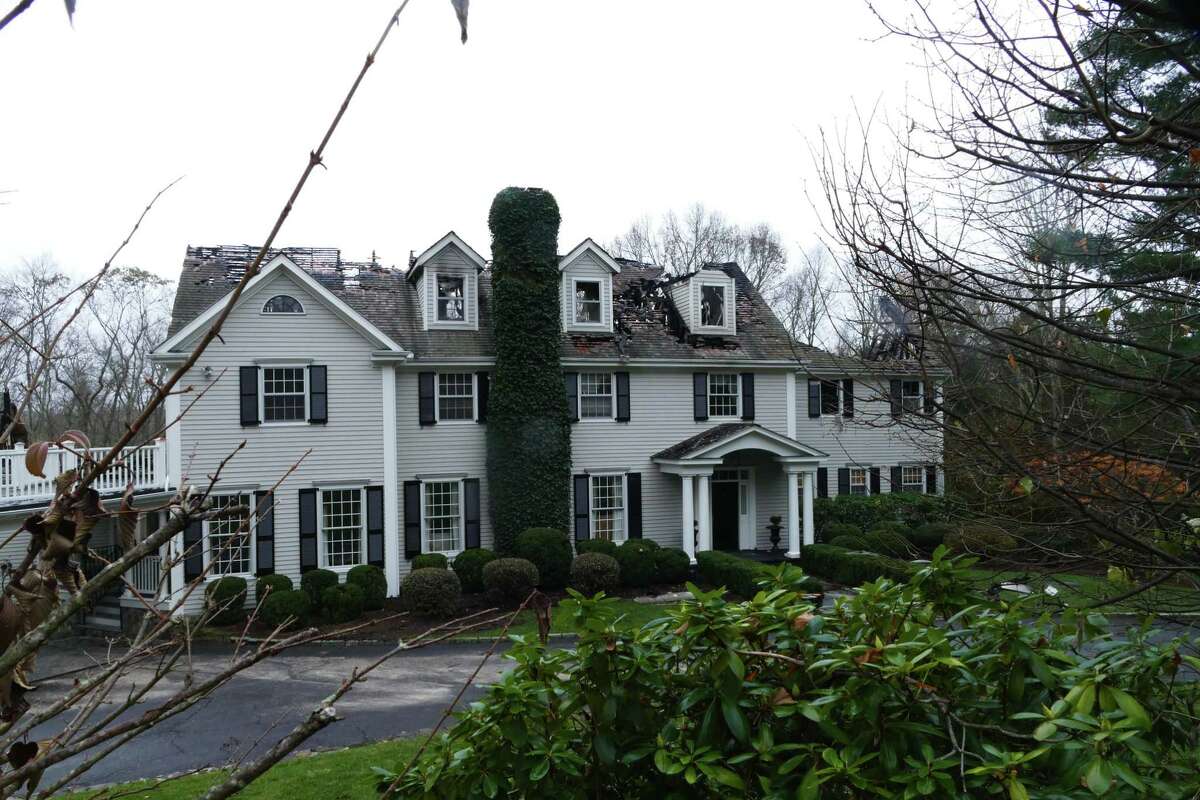 Fire rips through New Canaan home