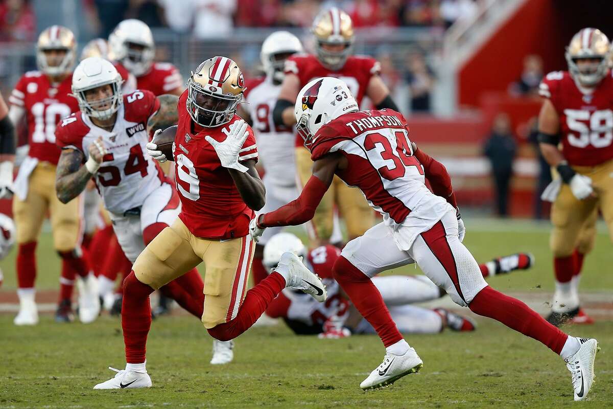 SANTA CLARA, CALIFORNIA - NOVEMBER 17: Wide receiver Deebo Samuel #19 of the San Francisco 49ers carries the football after a reception against safety Jalen Thompson #34 of the Arizona Cardinals during the first half of the NFL game at Levi's Stadium on November 17, 2019 in Santa Clara, California. (Photo by Lachlan Cunningham/Getty Images)