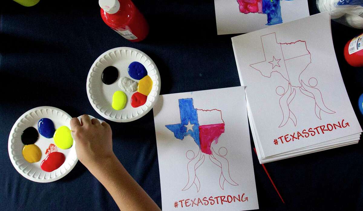 Children decorate art pieces with the hashtag #TexasStrong as hundreds of residents affected by Hurricane Harvey were provided a free meal at Sam K. Hailey Elementary School, Wednesday, Aug. 30, 2017, in Spring. The new Ready Rosie toolkit doesn’t just prepare kids for a coming storm, it also gives parents tools to talk to their kids after the storm.